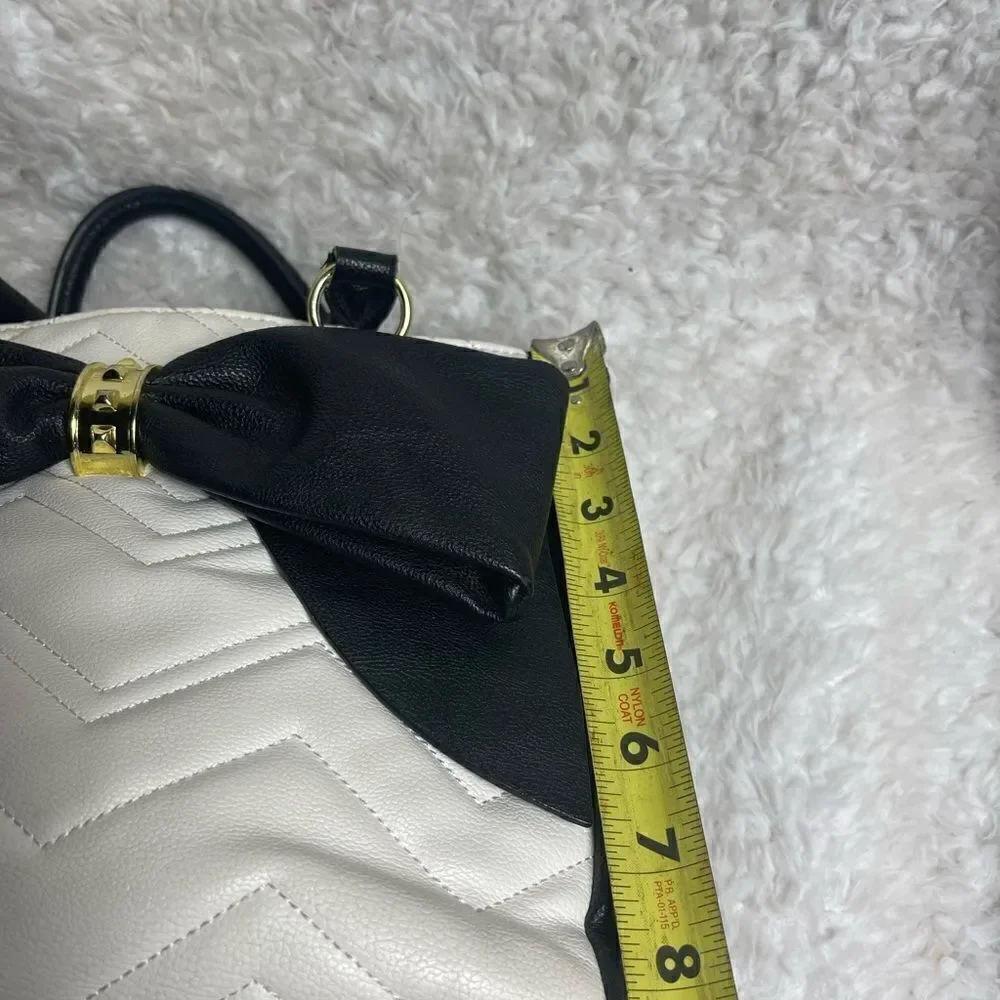 Betsey Johnson off white & Black quilted faux leather satchel with bow accent